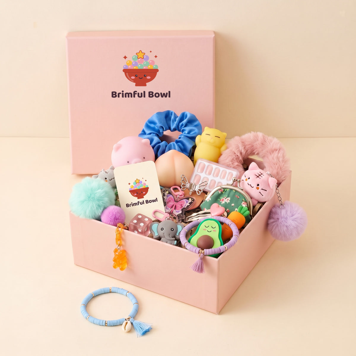 Small pink gift box filled with one scoop of cute surprises